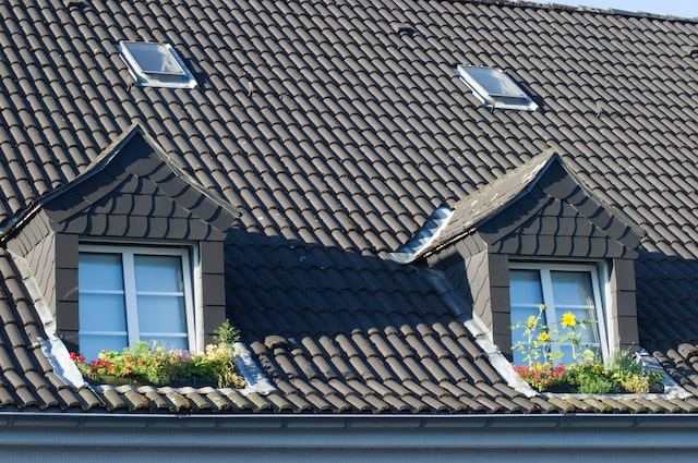 outside view on attic windows with flowers