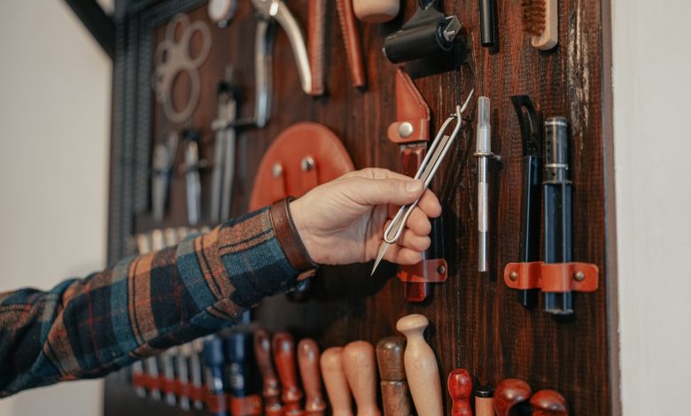 man takes a tool from the board