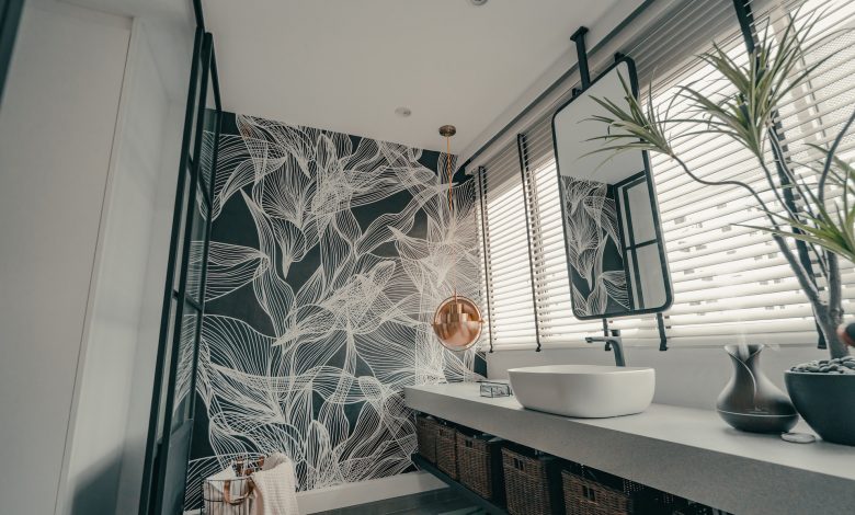 white ceramic sink near window