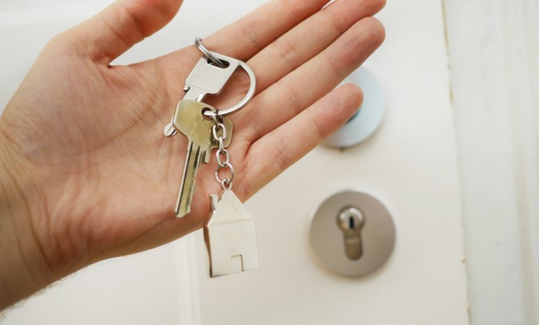 person holding door keys