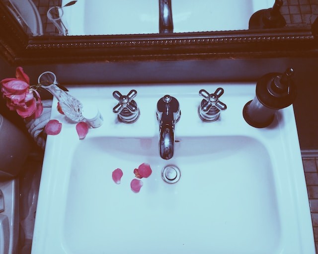 sink with rose petals