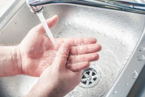 person washing hands