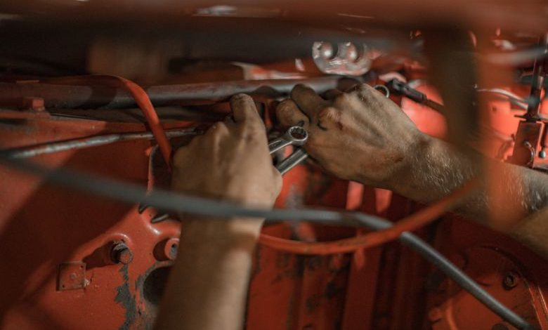 Impact Wrench Guide - person holding red metal frame