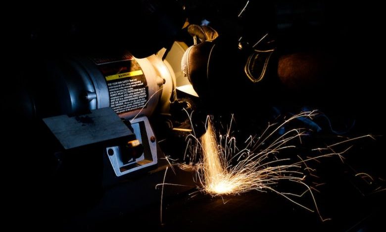 Bench Grinder - person using bench grinder