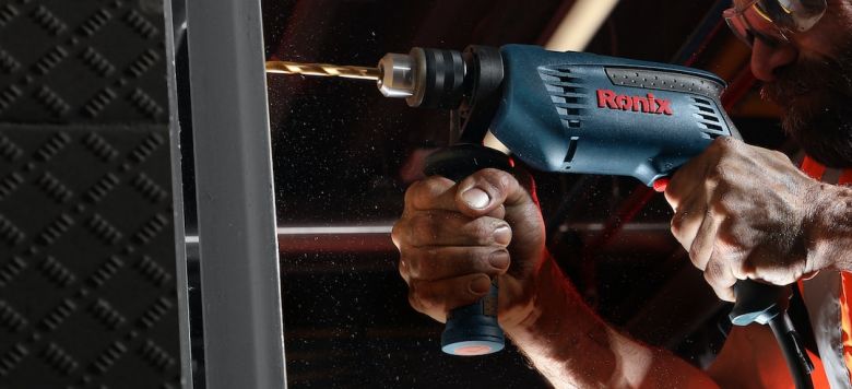 Power Tools - person holding blue and black cordless power drill