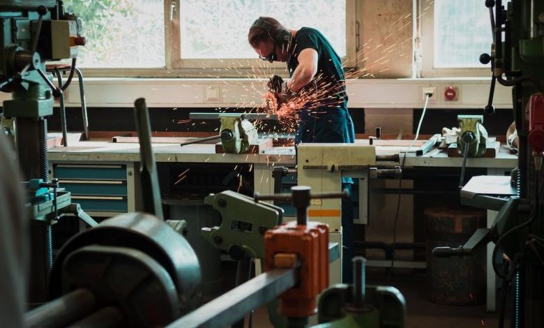 Oscillating Tool - selective focus photography of man using angle grinder