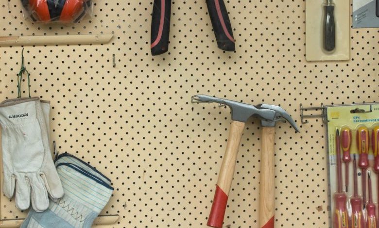 Hammer Comparison - black and silver claw hammer beside red and black hand tool