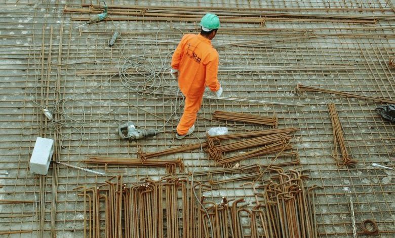 Home Construction Costs - man walking on construction site