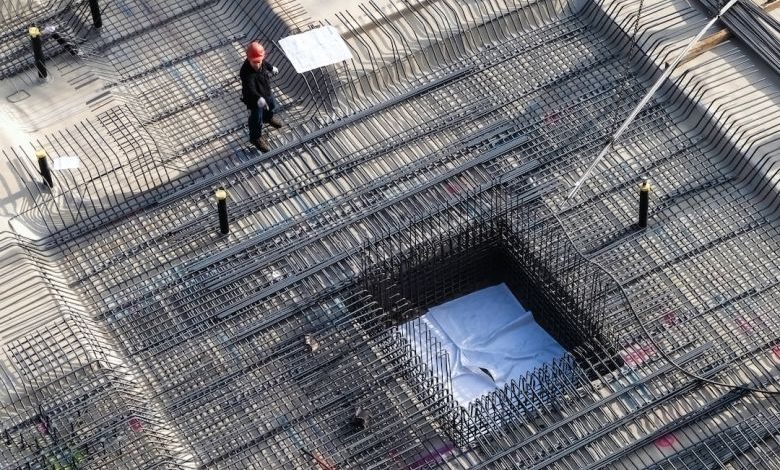 Waterproof Basement - man in black jacket walking on sidewalk during daytime