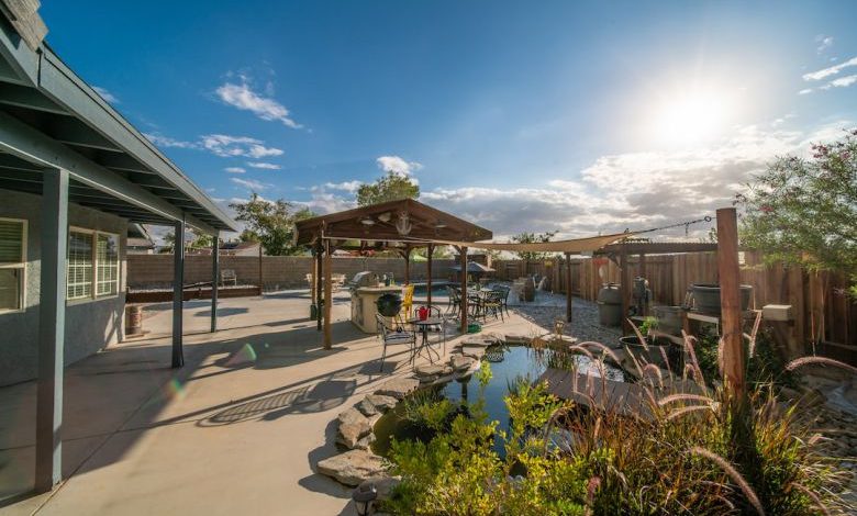 Backyard Pond - a backyard with a small pond and a gazebo