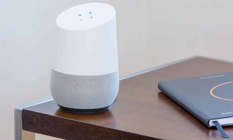 Home Automation - white and gray Google home on brown table