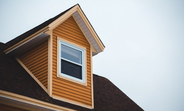 House Siding - brown wooden house under white sky during daytime