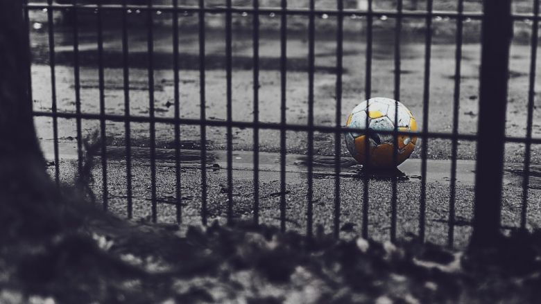 Backyard Playground - orange and green soccer ball on road