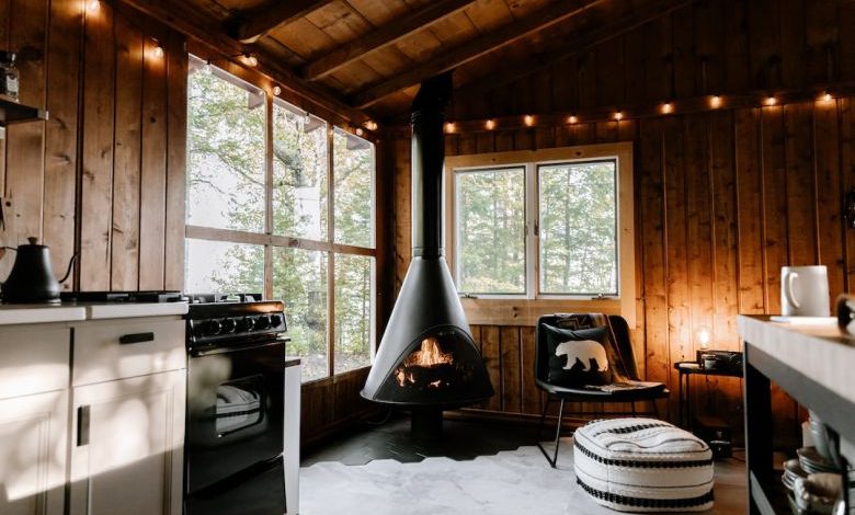 Home Fireplace - a room with a stove and a chair in it