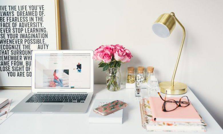 Natural Light In My Home - MacBook Air beside gold-colored study lamp and spiral books