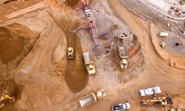 Construction Equipment - aerial photography of dump trucks