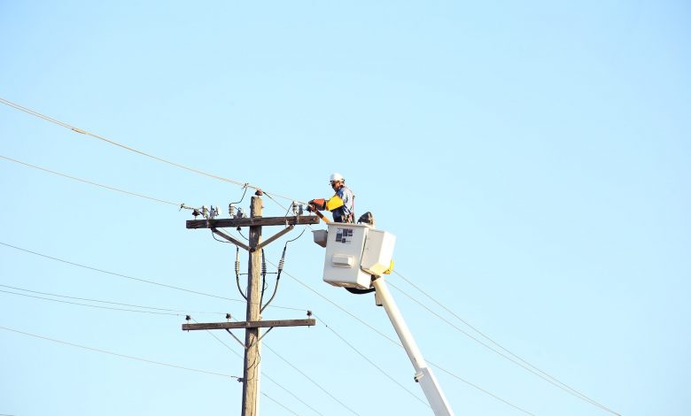 man working with electricity lines