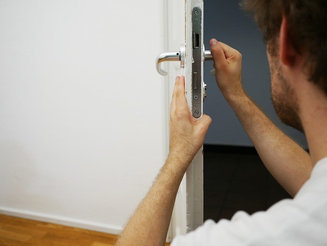 person working with door