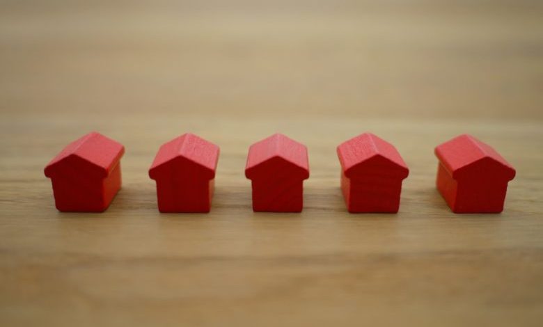 Homeowner - red blocks on brown wooden table