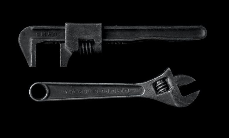 Tool Belt Essentials - gray adjustable wrench and gray pipe wrench