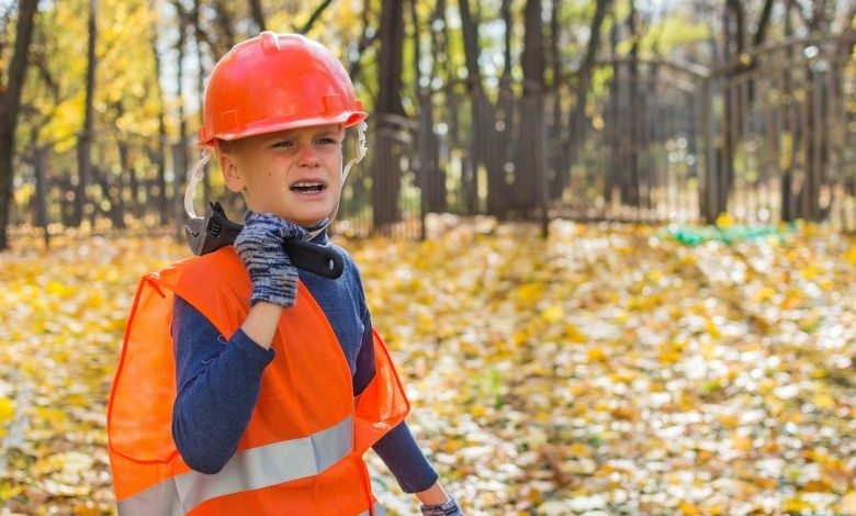 Handling Equipment - boy in orange helmet and blue and orange jacket