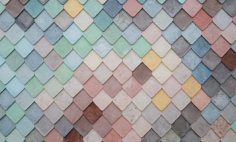 Wet Tile Saws - a multicolored tile wall with a pattern of small squares