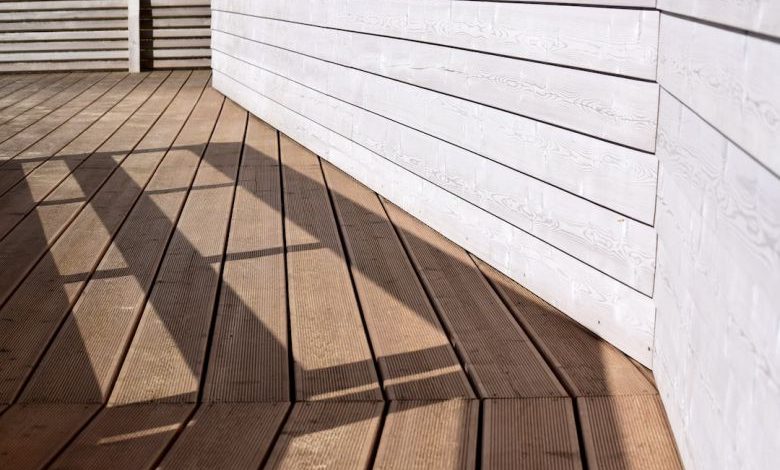 Wooden Deck - the shadow of a person standing on a wooden deck