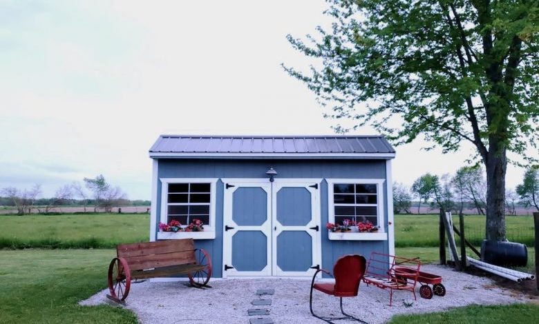 Garden Shed - brown wooden picnic table near white wooden house during daytime