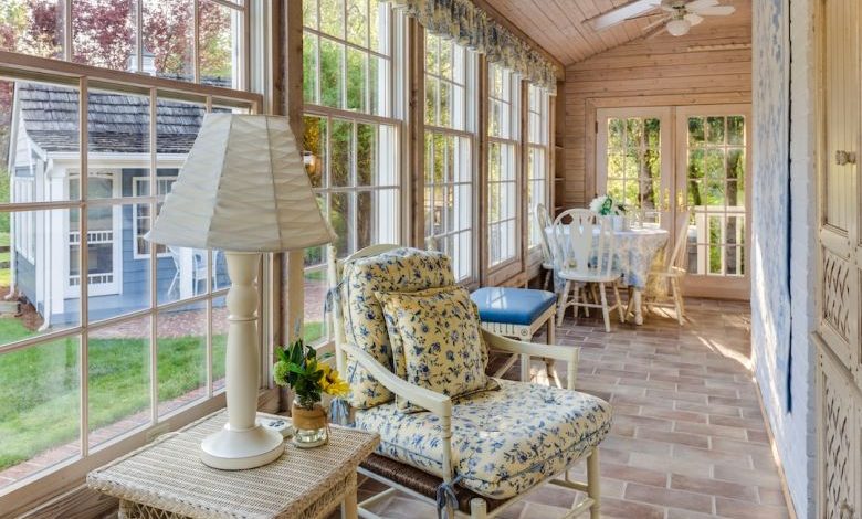 Sunroom In Home - white table lamp beside armchair