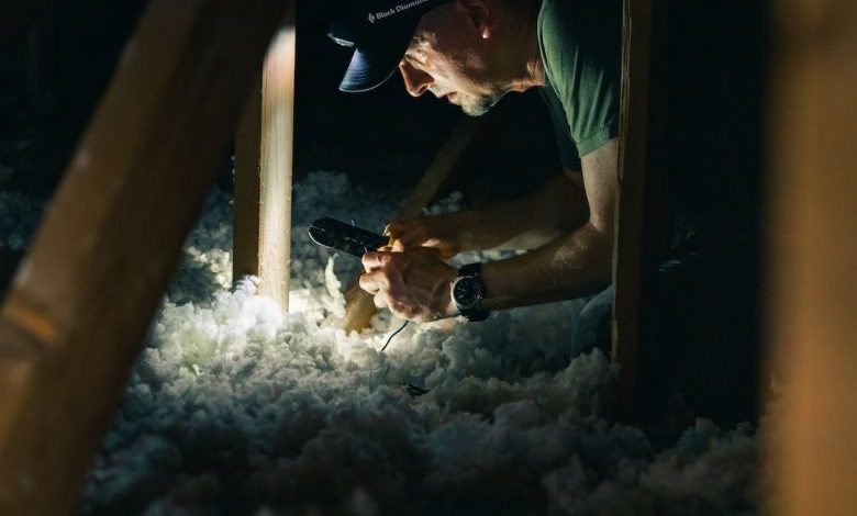 Attic Insulation - man in green crew neck t-shirt holding smoking pipe