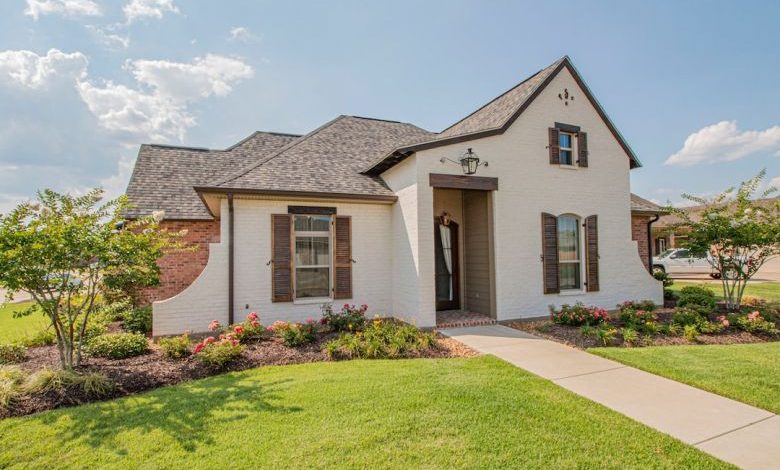 Home Landscaping - brown and white concrete house