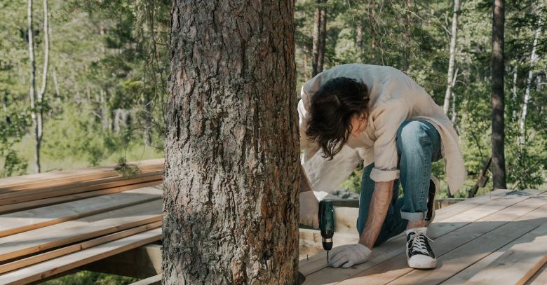 Electric Screwdriver - Man Using an Electric Screwdriver on Wood Plank