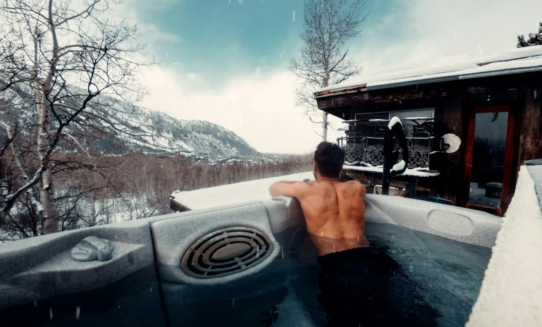 person in hot tub in winter