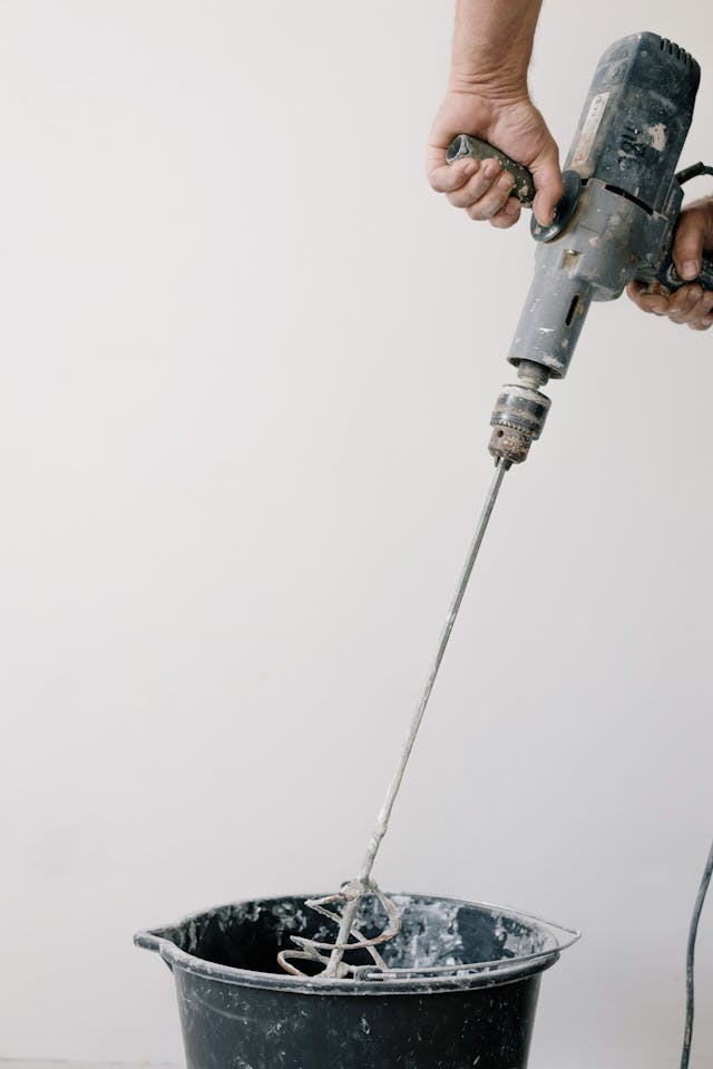 crop-man-preparing-cement-at-home