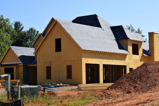 brown-and-gray-wooden-2-storey-house-near-tree