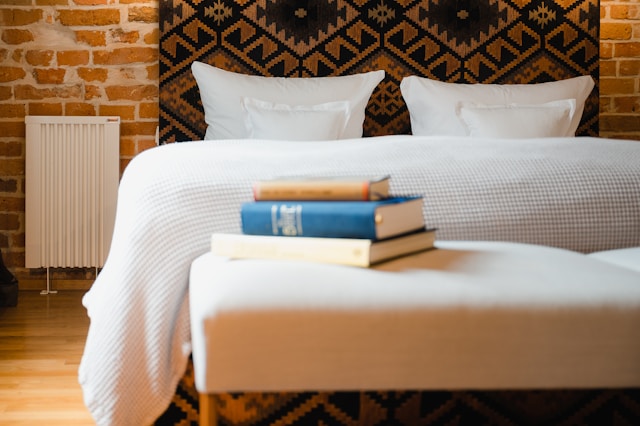 a-bed-with-books-on-it