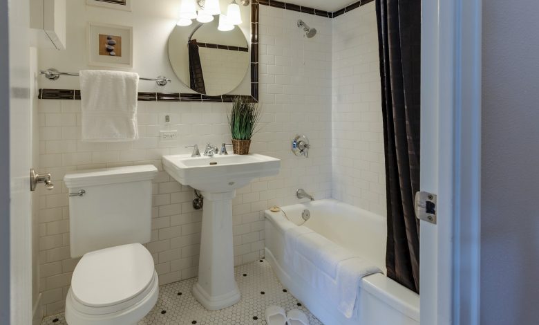 white-ceramic-toilet-bowl-beside-pedestal-sink