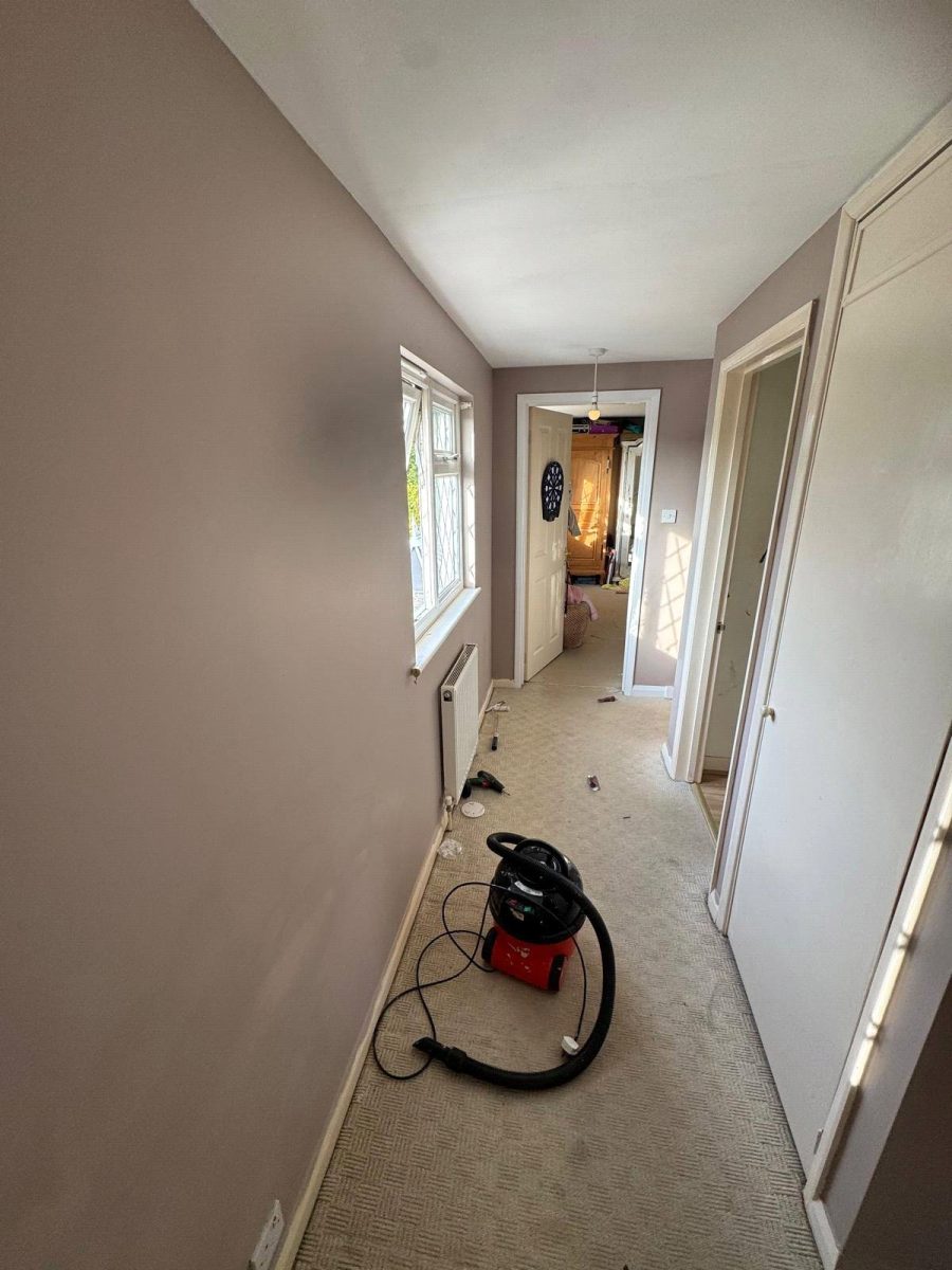 Exterior house painting in progress on a traditional Sussex property near Brighton, showcasing expert craftsmanship